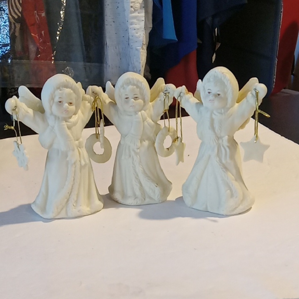 Angel Figurines Holding Ornaments Set Of 3 Ceramic